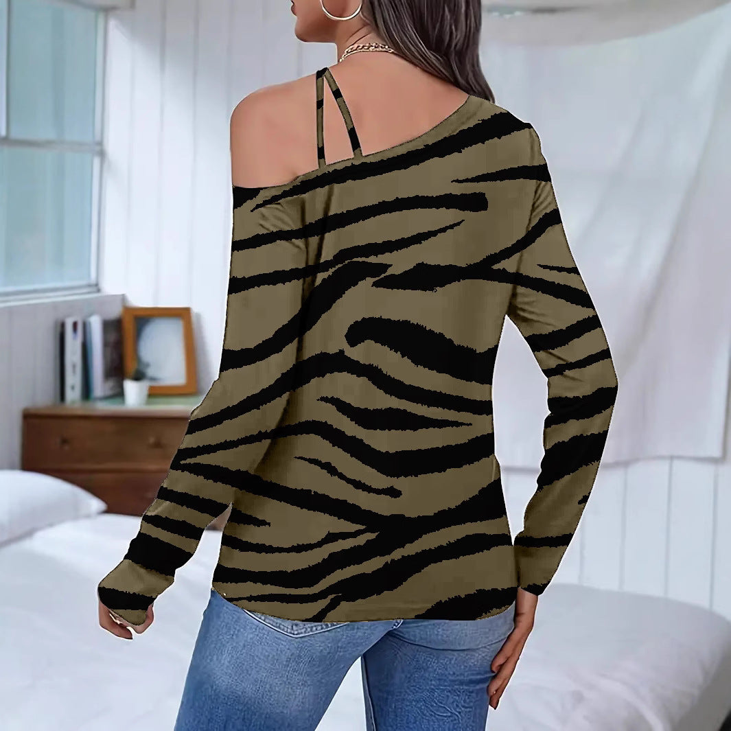 Dame casual top med ekstravagant skulderdesign og dyreprint Stilla