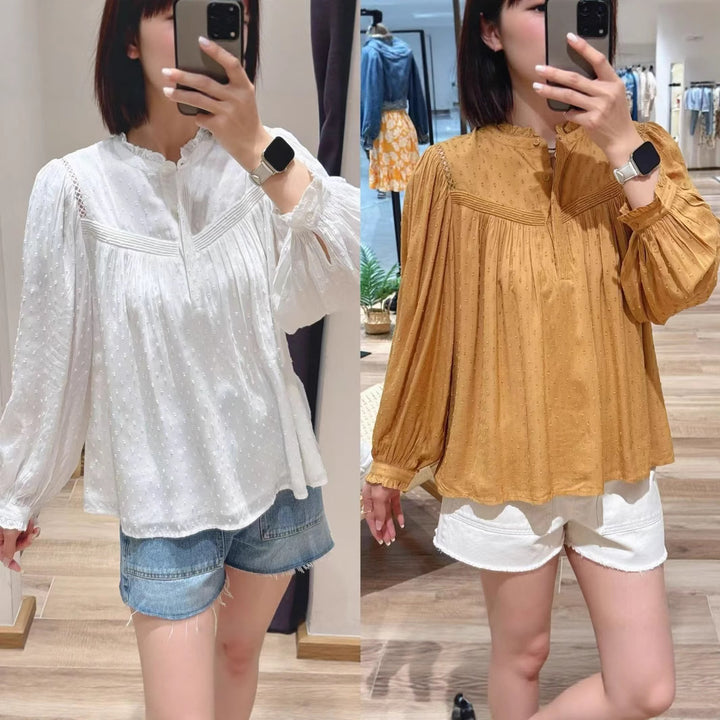Damebluse med elegant krave og raffinerede pufærmer Stilla