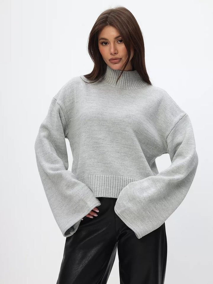 Kvindernes chunky strikket sweater med stående krave og voluminøse ærmer Stilla