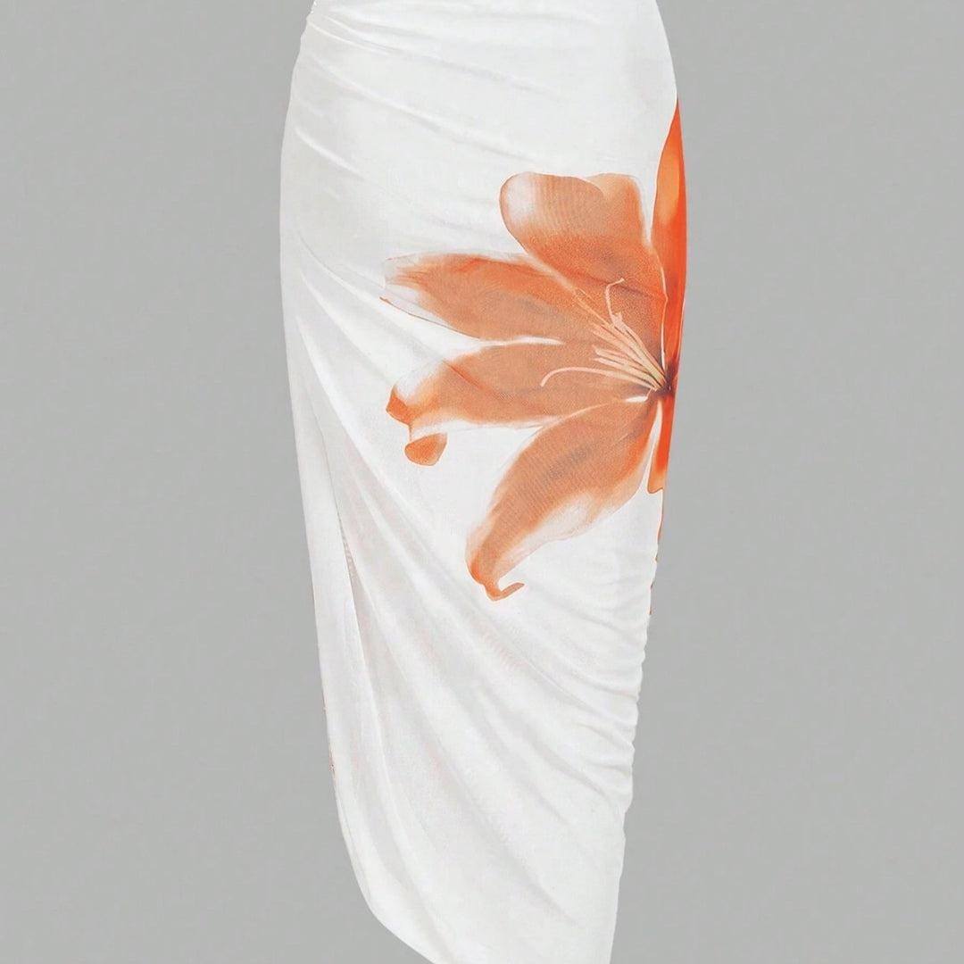 Dame badedragt med elegant blomsterdesign og matchende omslagsskjørt Skovae