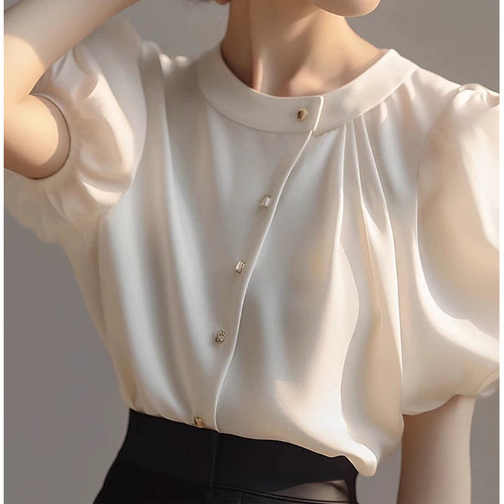 Dame elegant bluse med voluminøse ærmer og dekorative knapdetaljer Stilla