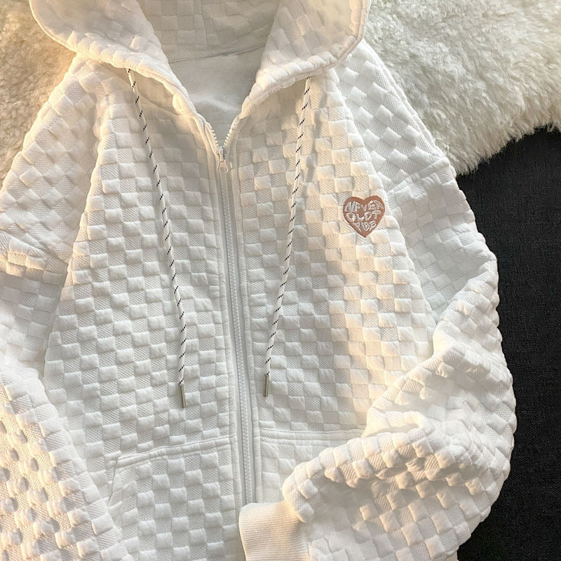 Dame hoodie jakke lavet af struktureret materiale med praktiske lommer og fashionable design