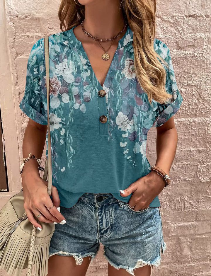 Damebluse med blomsterdesign og knaplukning Stilla
