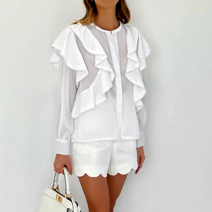 Damebluse med voluminøse flæser og elegant ståkrave Stilla