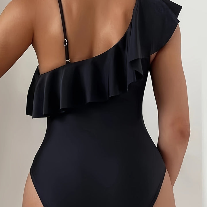 Dame one-piece badesuit med asymmetrisk ruffles design og elegante cut-out detaljer Skovae