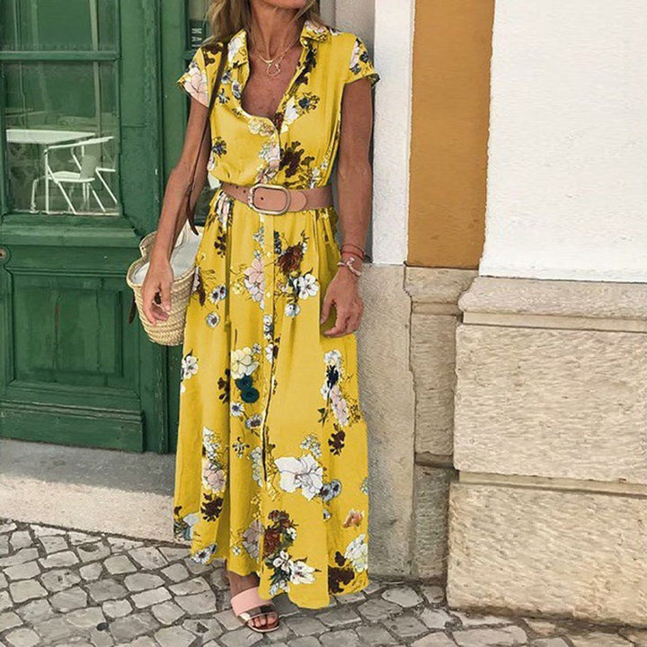 Dame maxikjole med blomsterdesign og praktisk bælte Stilla