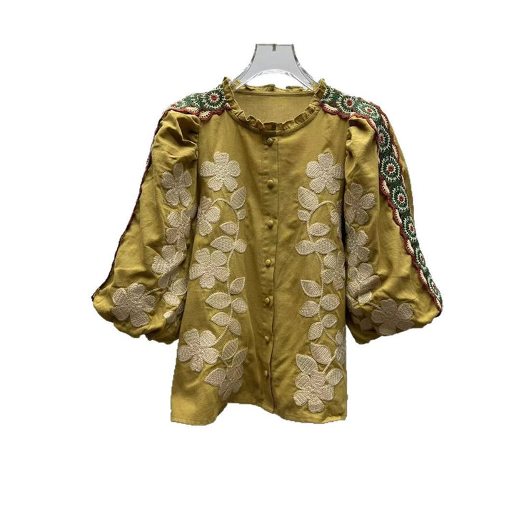 Damebluse med kunstneriske florale broderier og elegante pufærmer Stilla