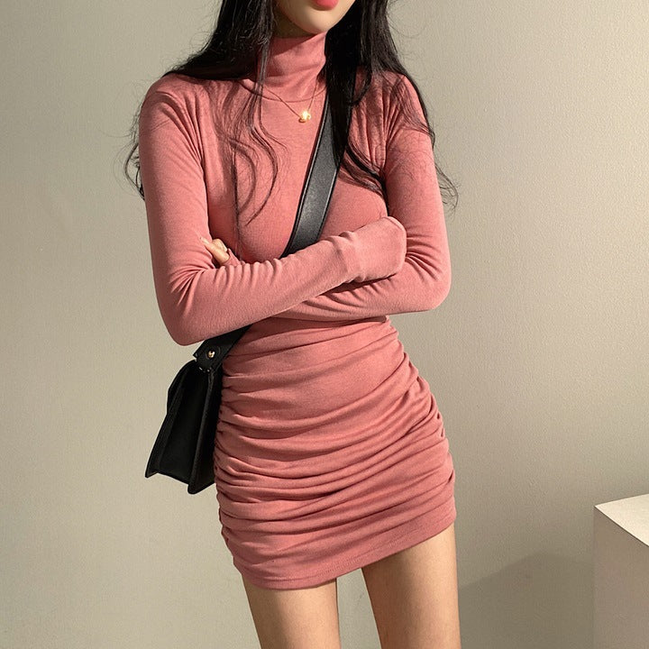 Kvindernes langærmede turtleneck top med elegant samlingseffekt og blødt materiale