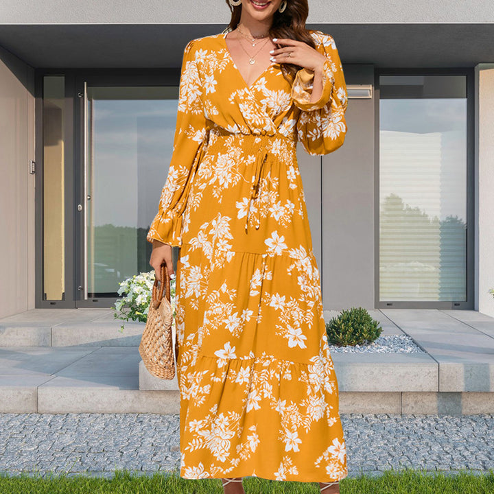 Dame maxikjole med voluminøse ærmer og florale detaljer Stilla