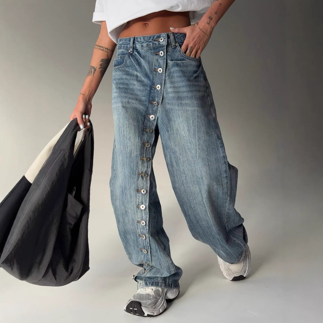 Kvinders bredskårne jeans med en continuér knapstolpe Stilla