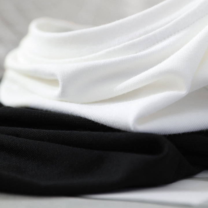 Femme elegant T-shirt med dekorativ V-udskæring og kunstnerisk knapdetalje Stilla