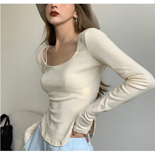 Kvindernes langærmede top med elegant udskæring og asymmetrisk design