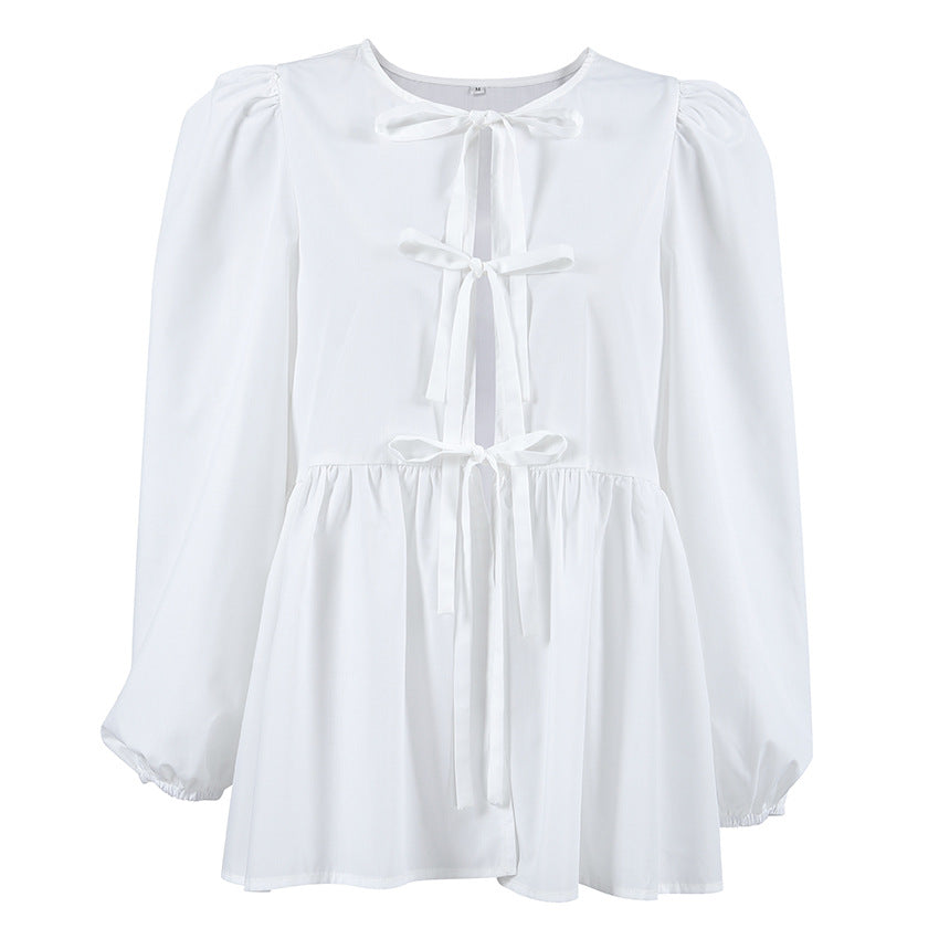 Damebluse med draperinger og dekorative sløjfer Stilla
