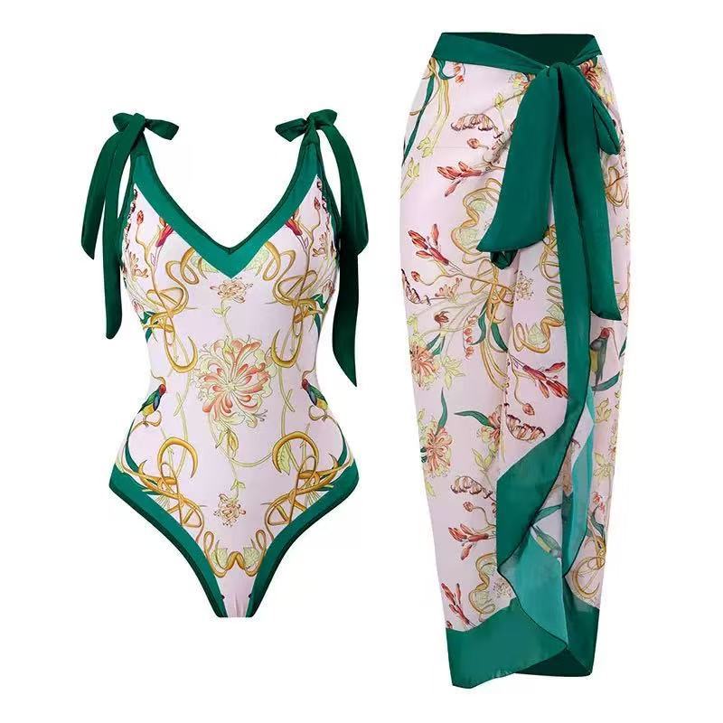 Dame badedragter med blomstret design og gennemsigtig omslagskørt Skovae