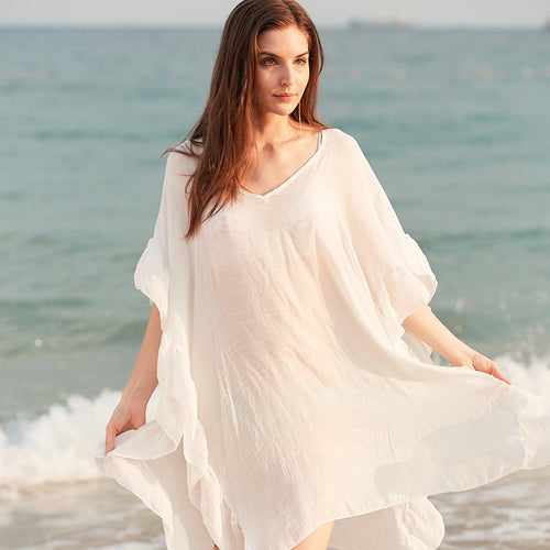 Damer elegant strandponcho med voluminøse flæsedetaljer Stilla