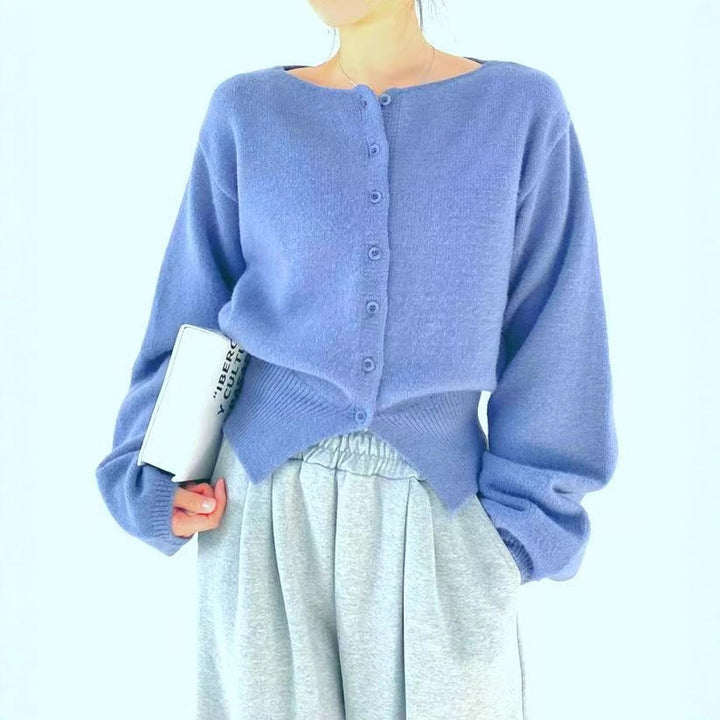Kvinders crop sweater med knapdetalje og oversized ærmer Stilla