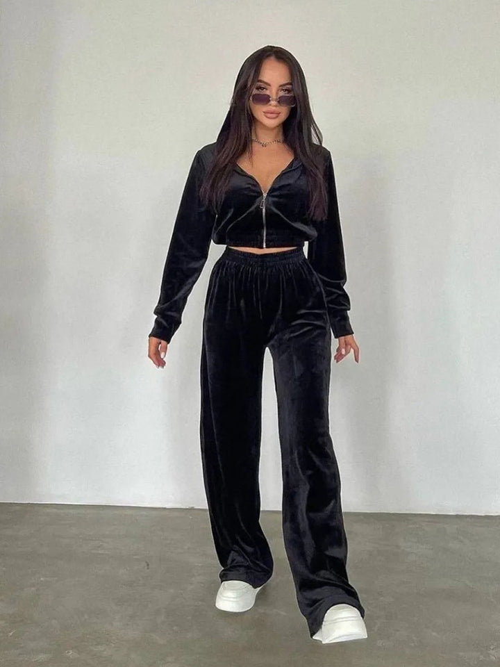 Kvinders fashionable velour sportsdragt med halv lynlås og elastiske manchetter Skovae