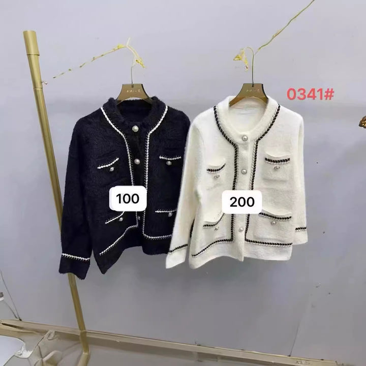 Kvindernes elegante cardigan med kontrasterende detaljer og lommer Stilla