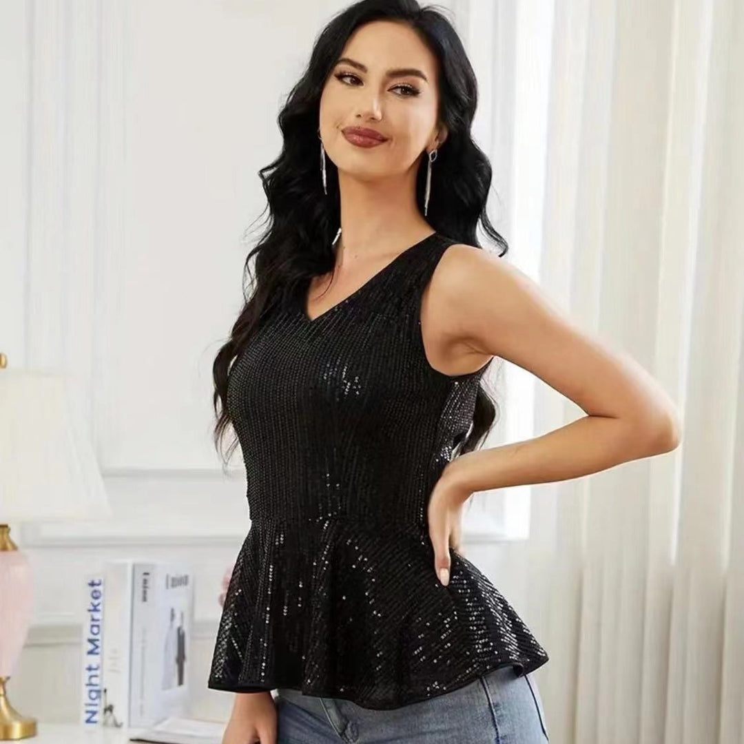 Dame Peplum top med skinnende pailletdetaljer og elegant snit Stilla