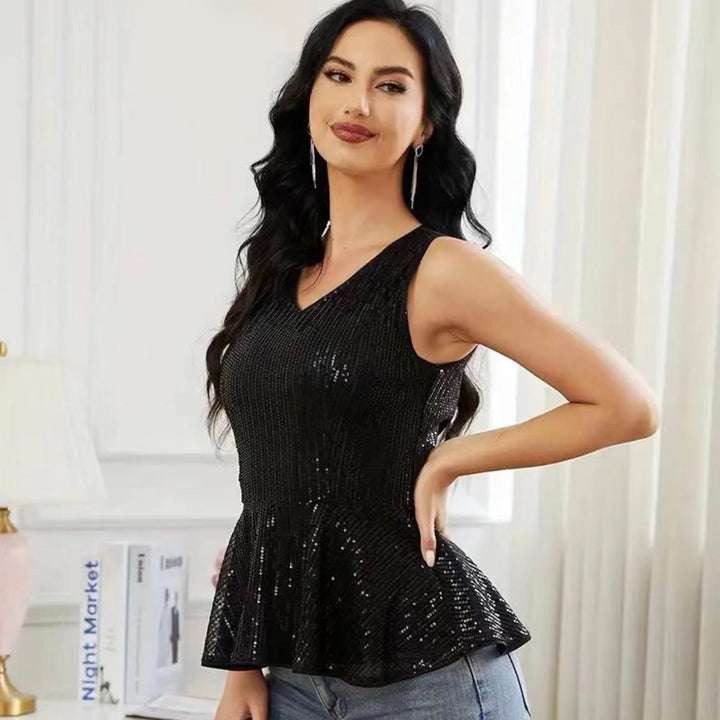 Dame Peplum top med skinnende pailletdetaljer og elegant snit Stilla
