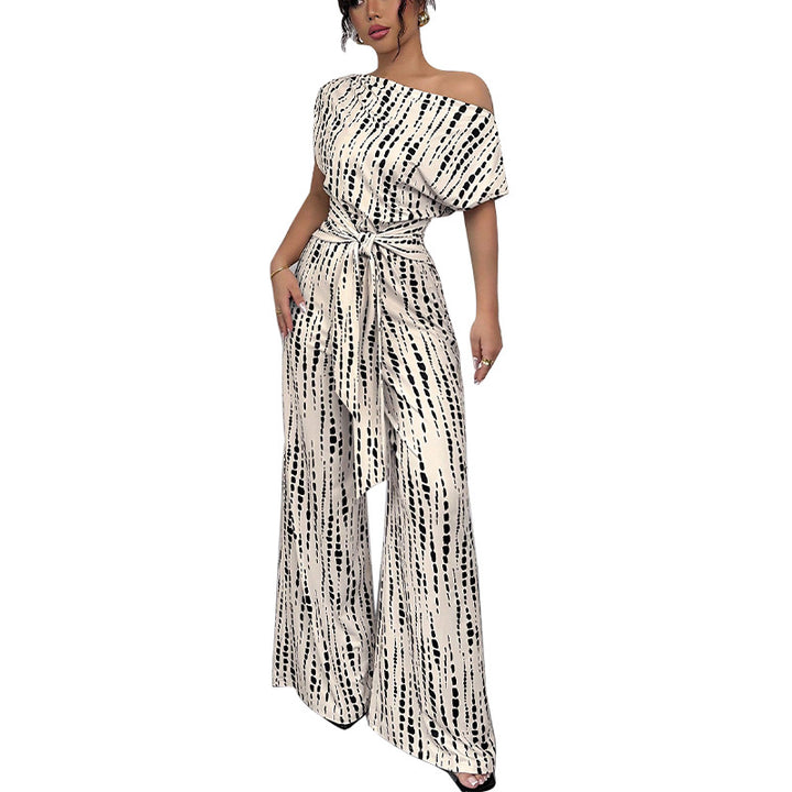 Dame elegant og luftig jumpsuit med asymmetrisk snit og bindebælte Stilla