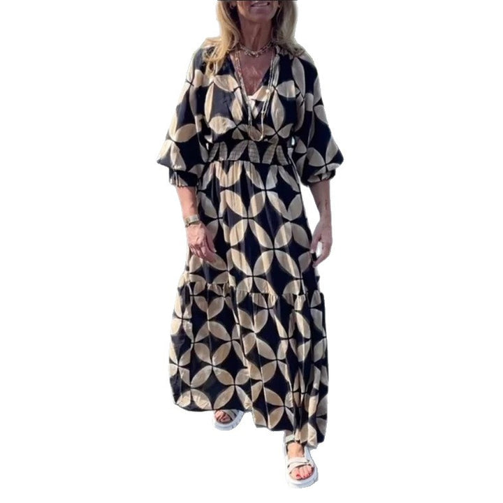 Dame nan Maxikjole med geometrisk alloverprint, smocket talje og flæser
