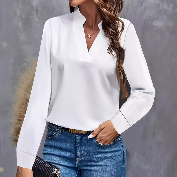 Dame elegant bluse i minimalistisk design med dekorativ V-udskæring og lange ærmer Stilla