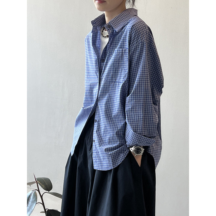 Dame afslappet ternet bluse med asymmetrisk kant og praktisk brystlomme Stilla