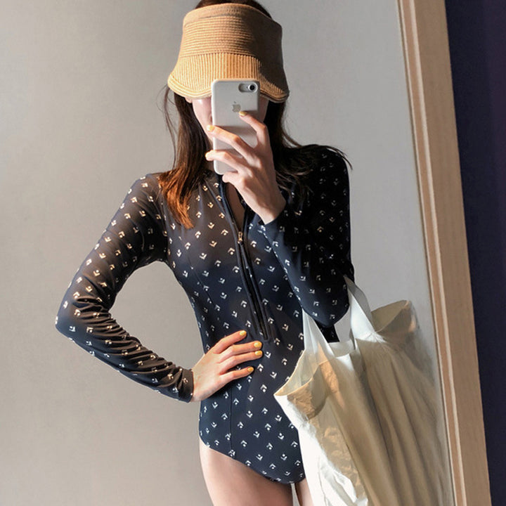 Dame én-delt badedragt med trendy lynlås og elegant mønster Stilla
