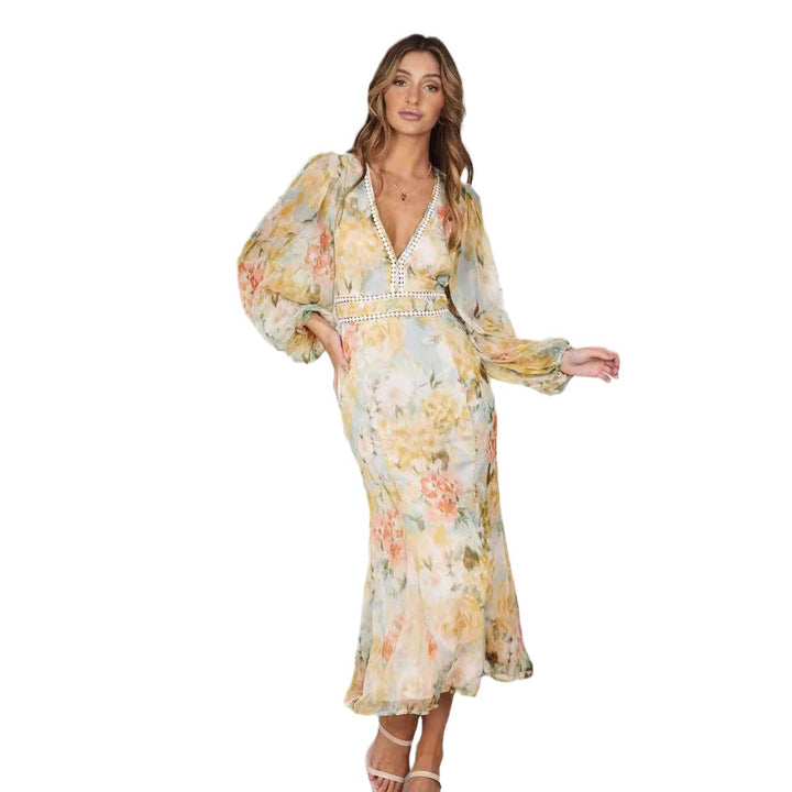 Dame Maxi-kjole med romantisk blomsterprint og elegante flæsedetaljer Stilla