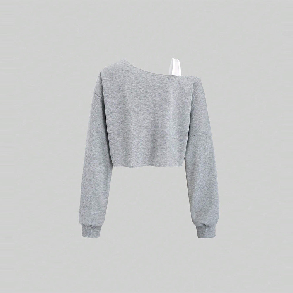 Kvinders cropped sweatshirt med asymmetrisk design og voluminøse ærmer Stilla
