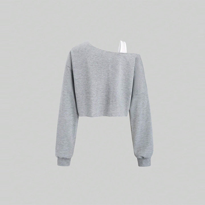 Kvinders cropped sweatshirt med asymmetrisk design og voluminøse ærmer Stilla