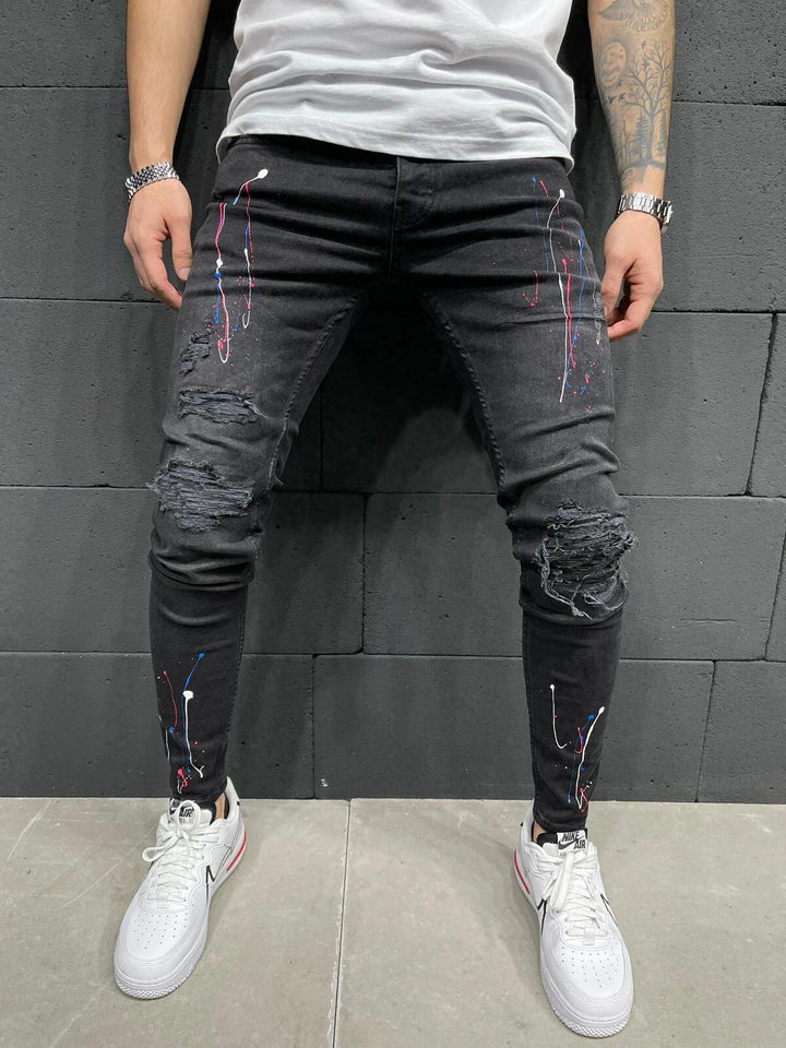 Herrer jeans i used-look med kreative farvesprøjt Stilla