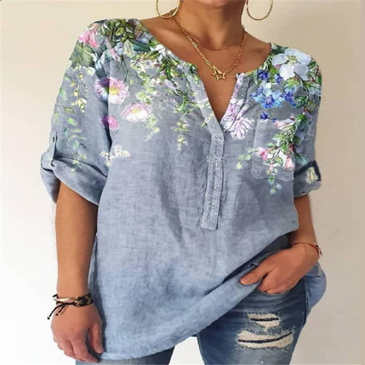 Damebluse med floral broderedesign og V-hals Stilla