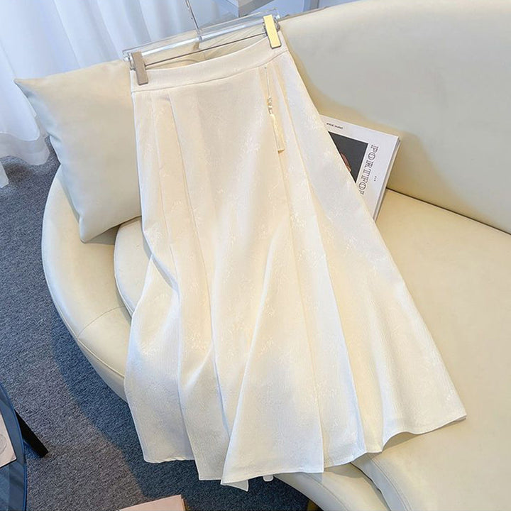 Kvinders elegante midi-nederdel med tekstureret stof og svajende snit