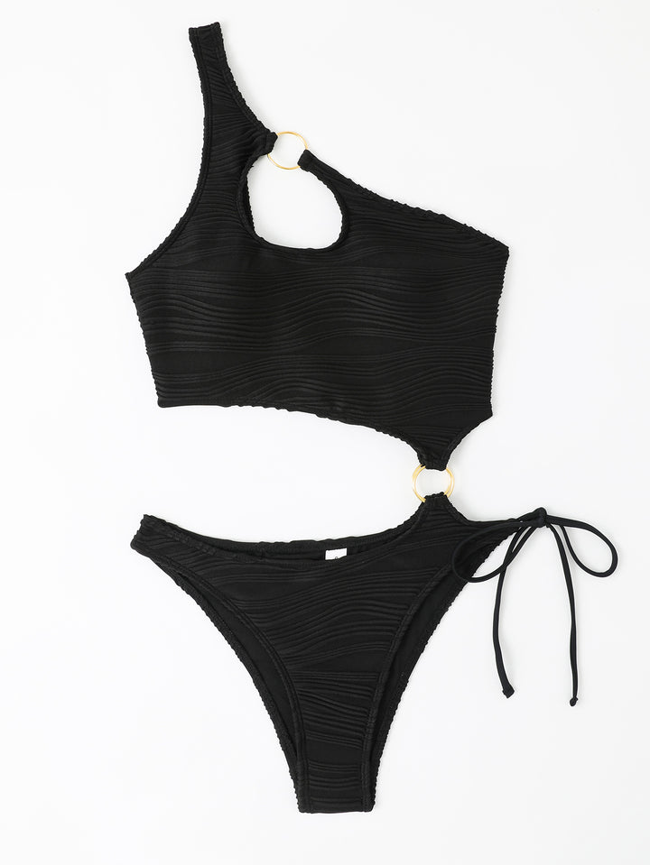 Dame badedragt med asymmetrisk cut-out og gyldne accenter Skovae