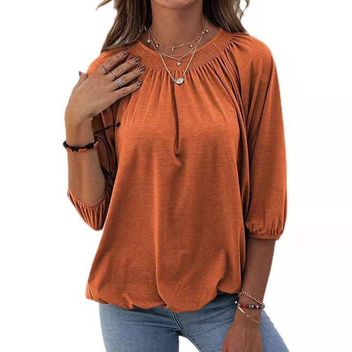 Dame afslappet bluse med casual snit og elastiske pufærmer Stilla