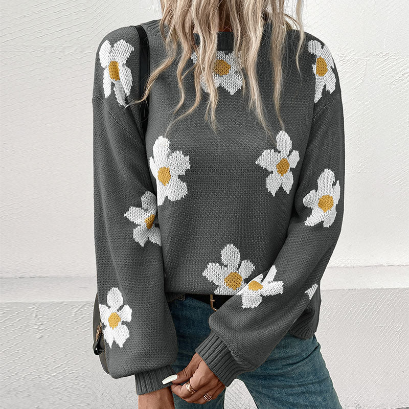 Dame strikbluse med florale accenter og løs pasform Stilla