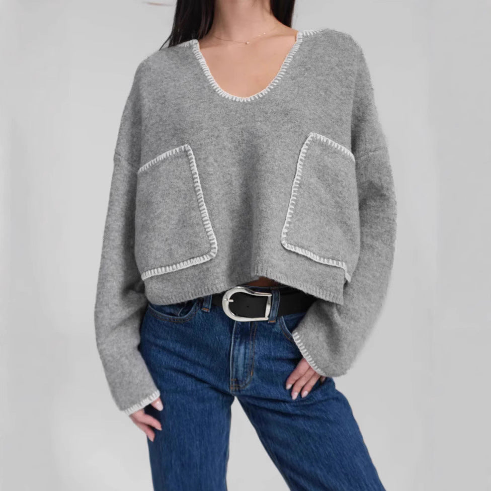 Kvinders hyggelige cropped sweater med asymmetrisk design og praktiske lommer Stilla