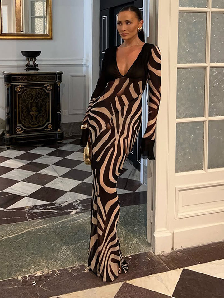 Dame maxikjole med asymmetrisk snit og elegant zebra-design Stilla