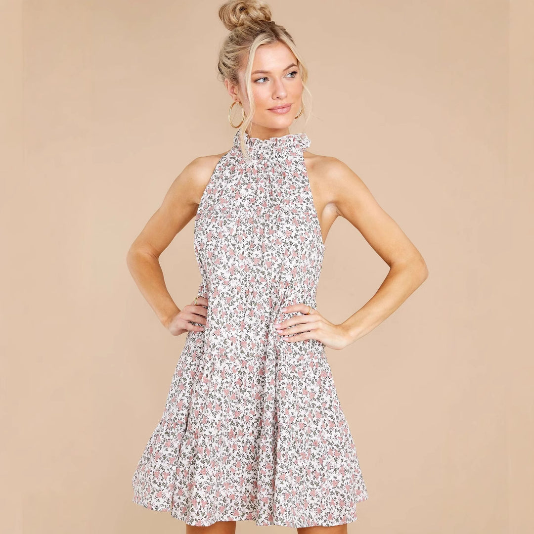 Women's halter dress with playful floral design and ruffle details