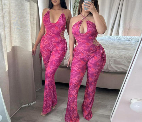 Dame luftig jumpsuit med dyb V-udskæring og legende bindebånd Stilla
