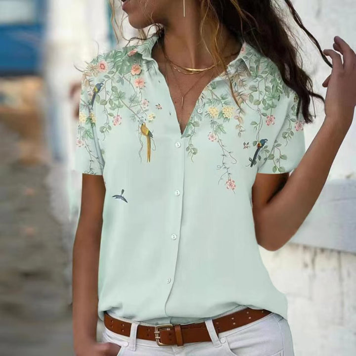 Damebluse med blomsterdesign og elegant snit Stilla