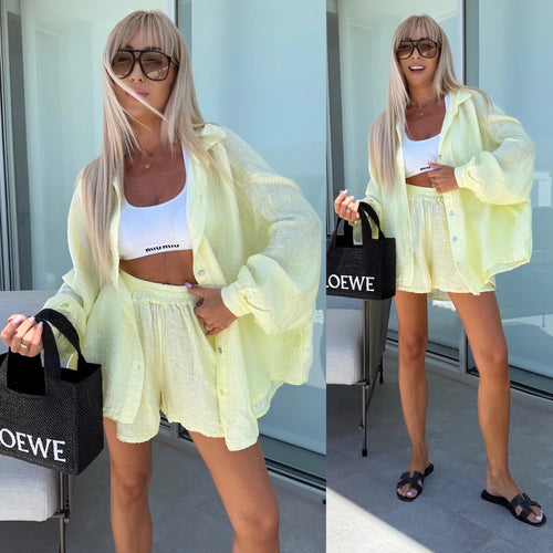 Kvinders casual kort sæt med asymmetrisk top og elastisk talje