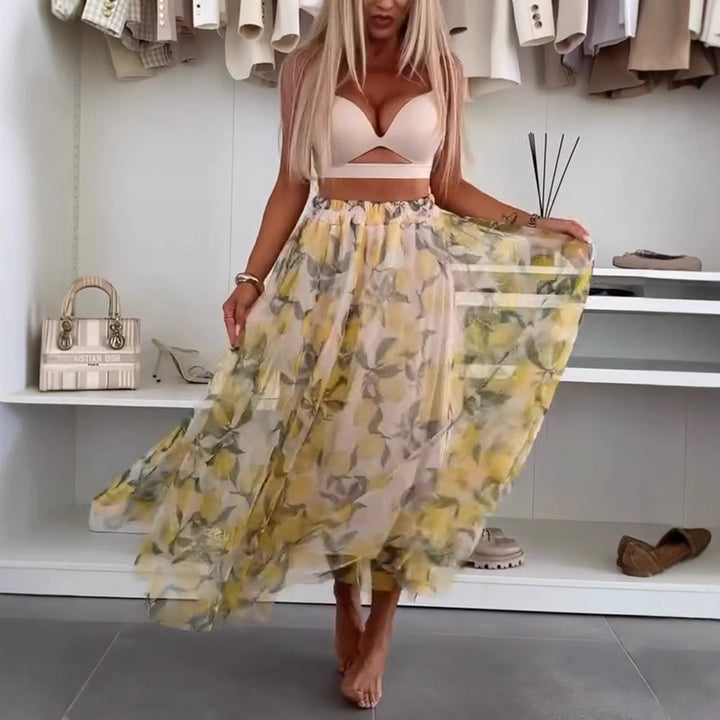 Dame med flydende Maxi-nederdel med flerlagd chiffon-overlag, elastisk talje og fint blomsterprint Skovae
