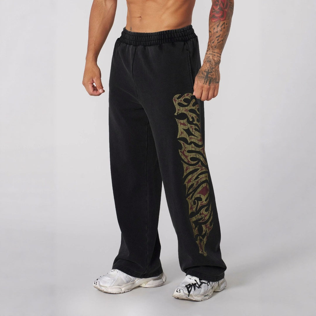 Herrer nan brede joggingbukser med elastisk talje, sidelommer og detaljeret kranium- og rosenmotiv Skovae