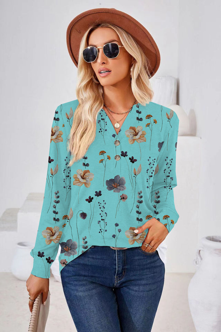 Damebluse med blomsterprint og knapdetaljer Stilla