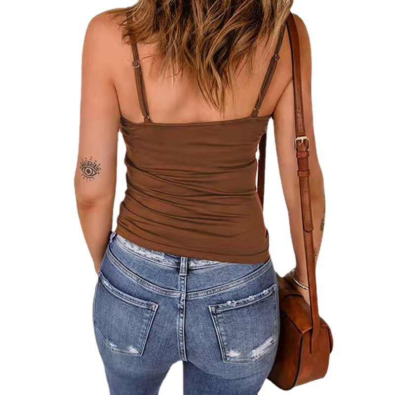 Dame tanktop med moderne kryds-stroppedesign og metalaccenter Stilla