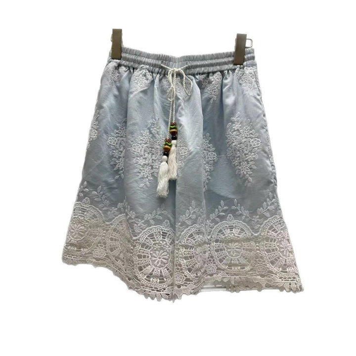 Dame Let bluse med florale spidsdetaljer og moderigtigt knapdesign Stilla