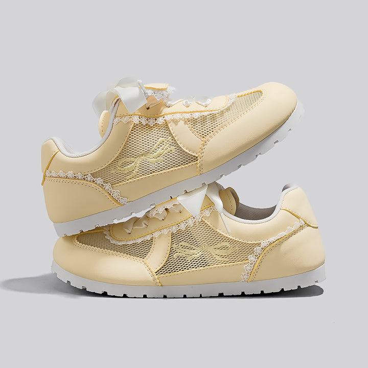 Dame Sneakers i romantisk design med dekorative sløjfer og åndbart mesh-overflade Stilla